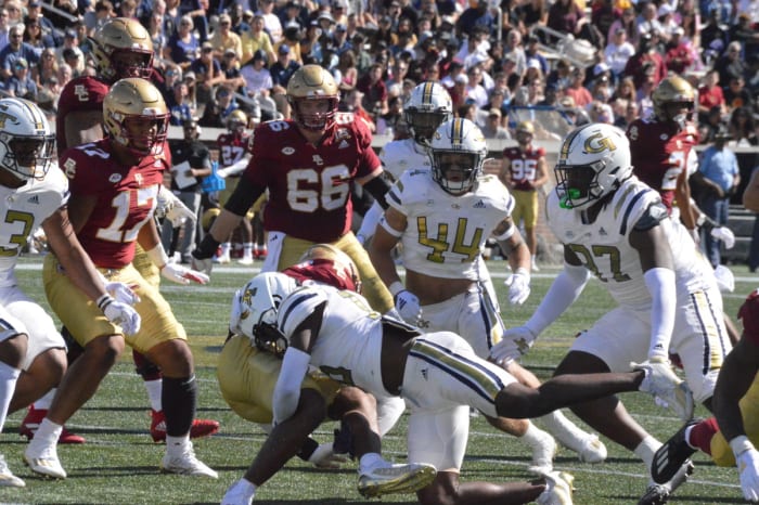 Georgia Tech's defense swarms a Boston College ball carrier
